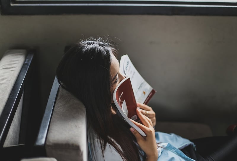Woman reading book in nature